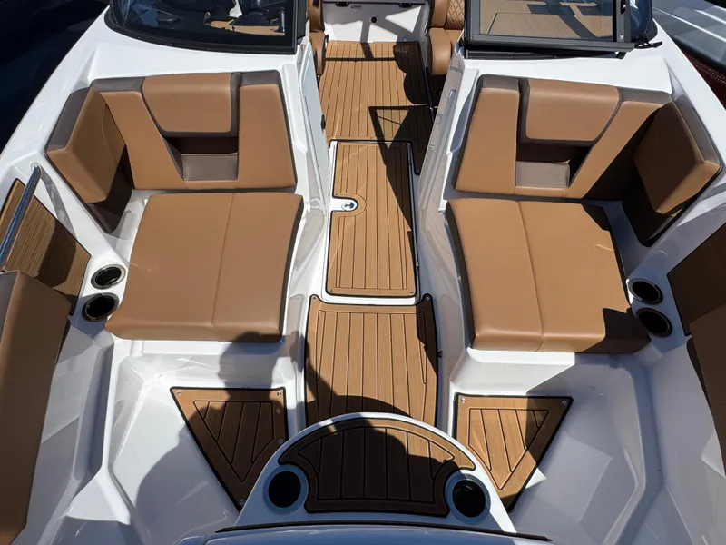 Slide: The Image of 2025 Yamaha Boats 222SD interior with tan seating and wood-style flooring. - 21