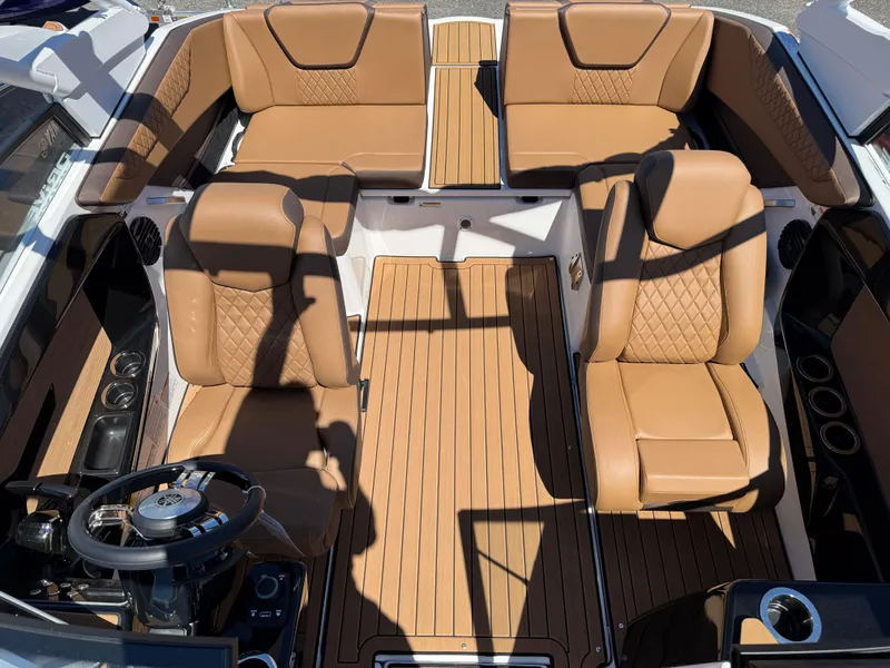 Slide: The Image of 2025 Yamaha Boats 222SD interior with tan leather seats and sleek design. - 24