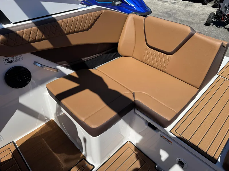 Slide: The Image of 2025 Yamaha Boats 222SD interior with tan seating and wood accents. - 27