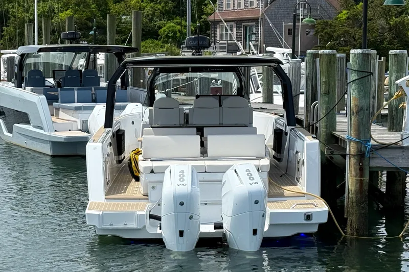 Slide: The Image of 2025 Fjord 39 XP boat docked with dual engines, featuring sleek design and spacious seating. - 11