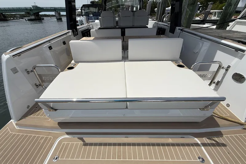 Slide: The Image of 2025 Fjord 39 XP yacht with spacious sunbathing area and sleek design. - 12