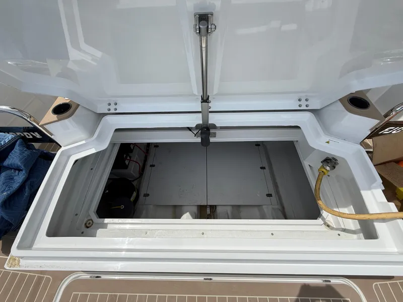Slide: The Image of Open storage compartment on 2025 Fjord 39 XP boat deck. - 17