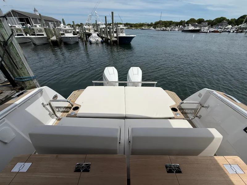Slide: The Image of 2025 Fjord 39 XP yacht at marina, featuring spacious deck and twin engines. - 25