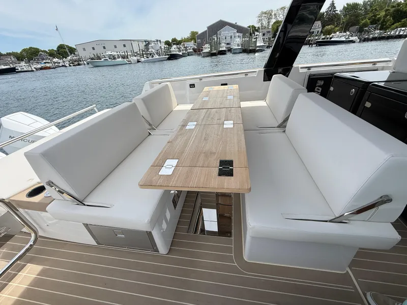 Slide: The Image of Luxurious seating area on 2025 Fjord 39 XP yacht, featuring sleek design and waterfront view. - 29