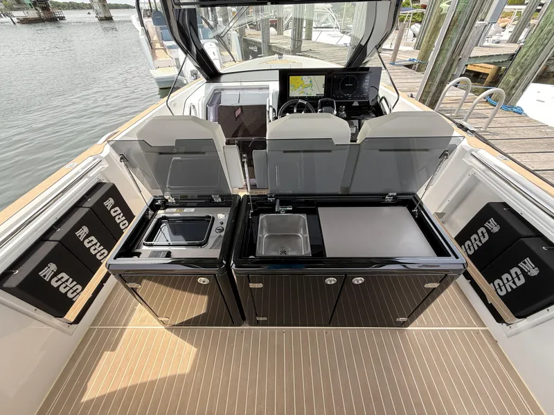 Slide: The Image of 2025 Fjord 39 XP yacht interior with modern kitchen amenities and sleek design. - 39