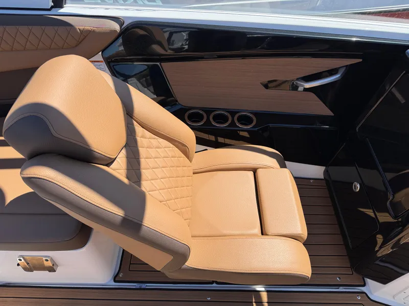 Slide: The Image of Luxurious tan seating in 2025 Yamaha Boats 222SD, featuring sleek design and premium materials. - 11