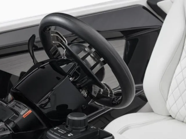 Slide: The Image of Steering wheel of 2025 Yamaha Boats 222SD, featuring sleek black and white interior design. - 40