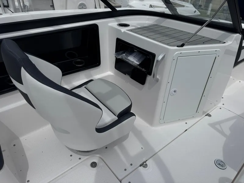 Slide: The Image of 2025 Yamaha Boats 195S interior with sleek seating and modern dashboard design. - 11