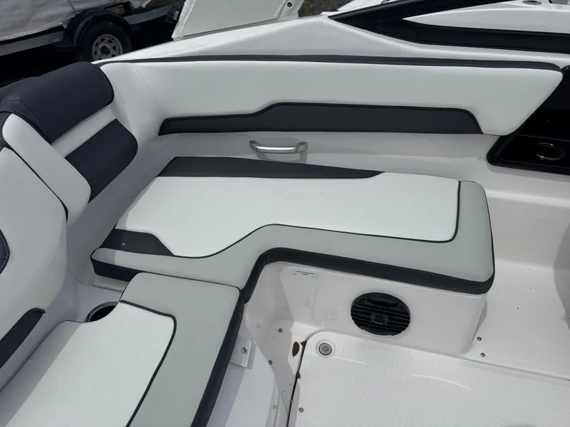 Slide: The Image of 2025 Yamaha Boats 195S interior seating with sleek, modern design and comfortable upholstery. - 12