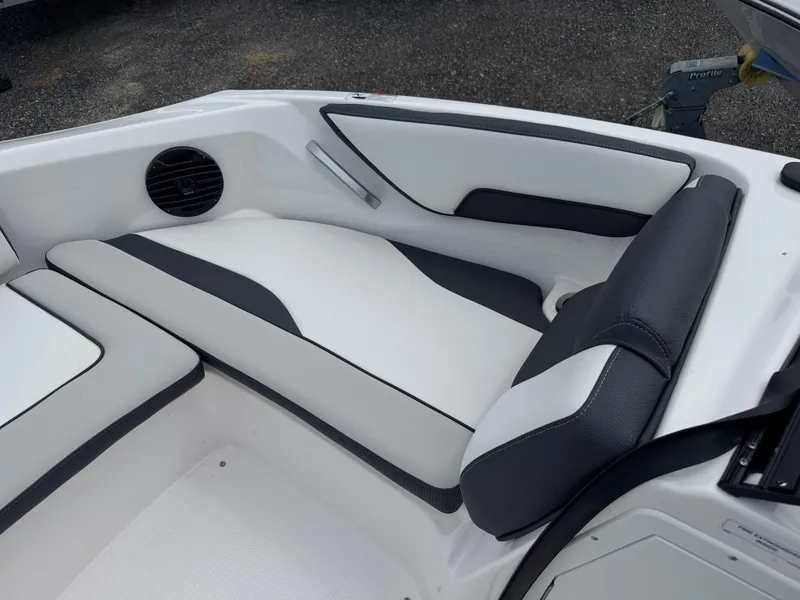 Slide: The Image of 2025 Yamaha Boats 195S interior seating with sleek white and black design. - 6