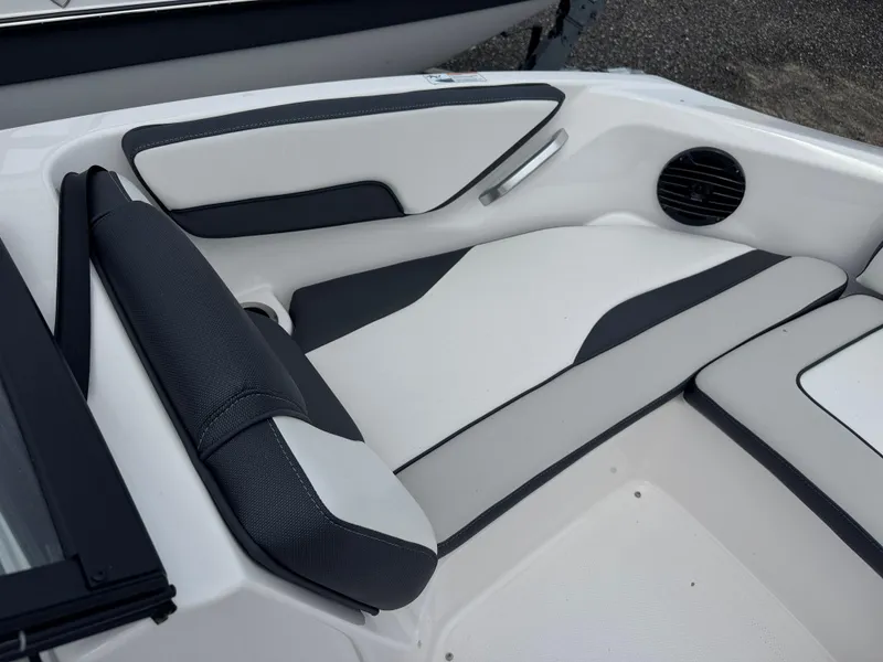 Slide: The Image of 2025 Yamaha Boats 195S interior seating with sleek black and white design. - 7
