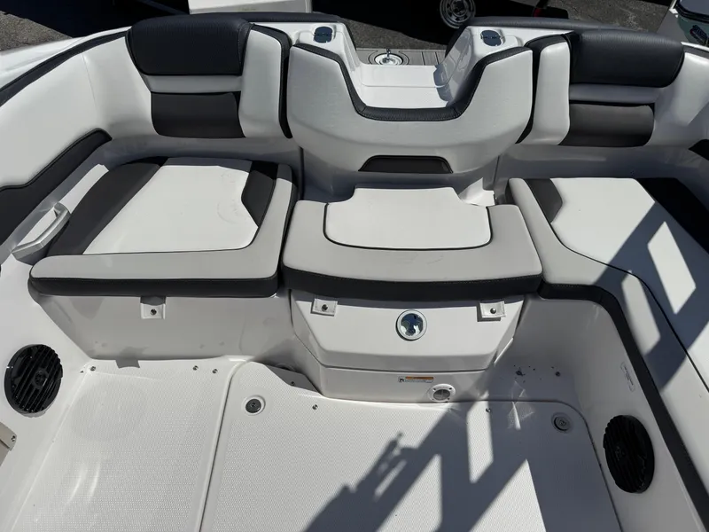 Slide: The Image of 2025 Yamaha Boats 195S interior seating area with sleek, modern design and comfortable upholstery. - 17