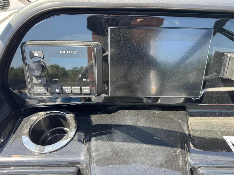 Slide: The Image of Control panel of 2025 Yamaha Boats 195S with Hertz audio system and display screen. - 20