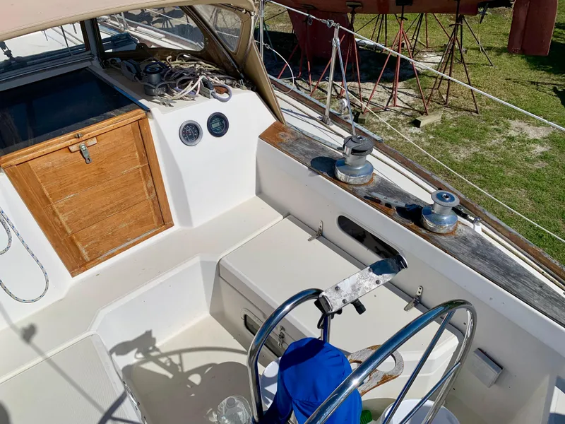 Slide: The Image of Cockpit of 1986 Sabre 36 sailboat with wooden hatch and steering wheel. - 17