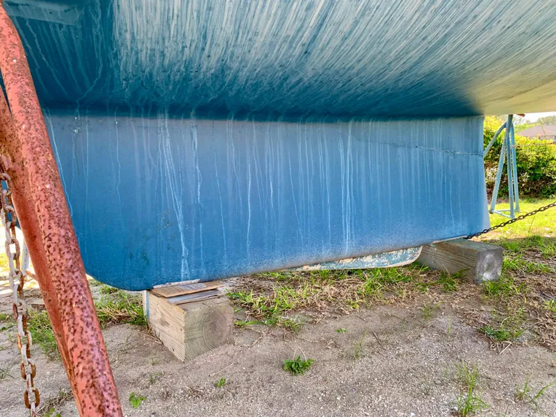 Slide: The Image of 1986 Sabre 36 sailboat keel on dry land, supported by wooden blocks. - 22