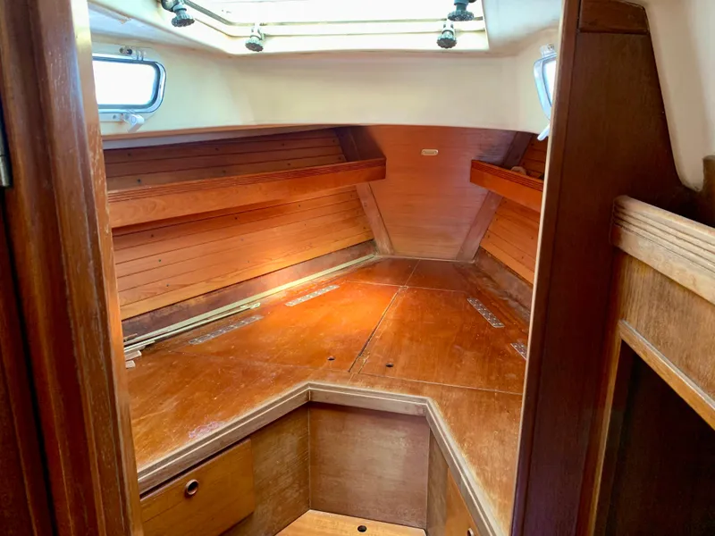 Slide: The Image of 1986 Sabre 36 sailboat interior with wooden cabin and natural light. - 25