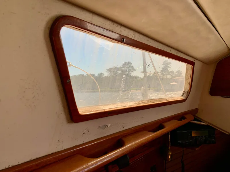 Slide: The Image of Interior view of 1986 Sabre 36 sailboat, showing window and wooden trim. - 29