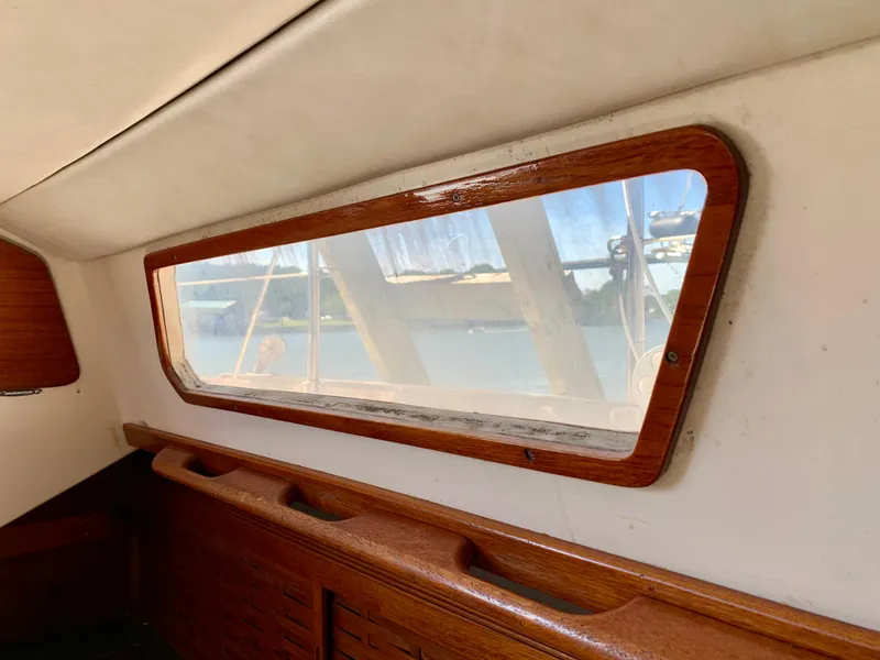Slide: The Image of Interior view of 1986 Sabre 36 sailboat window with wooden trim. - 30