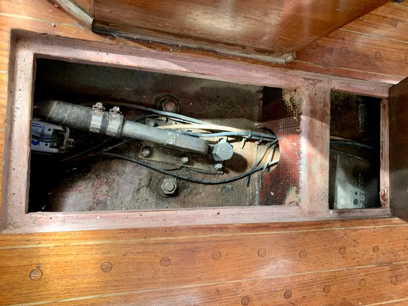 Slide: The Image of Wooden interior of 1986 Sabre 36 sailboat showing exposed mechanical components. - 33