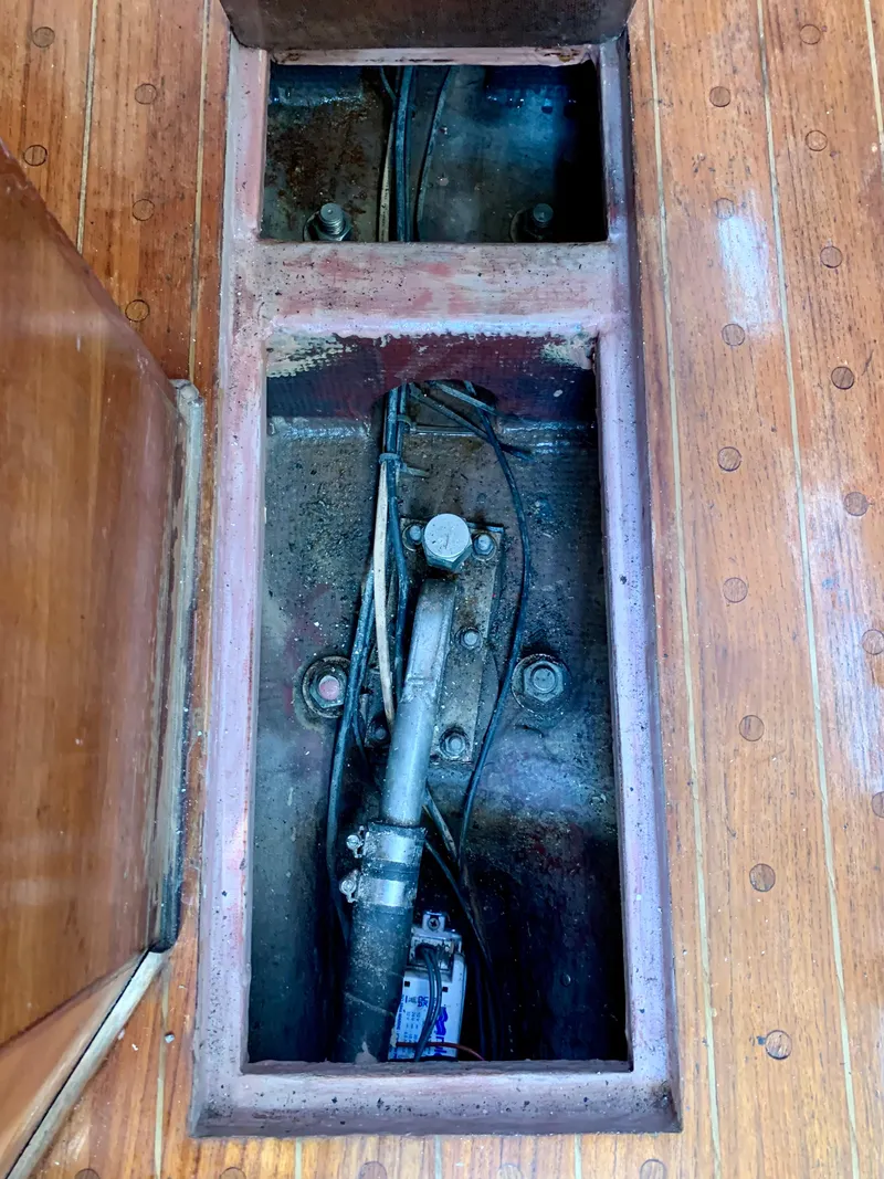 Slide: The Image of Bilge compartment of 1986 Sabre 36 sailboat with visible wiring and piping. - 34