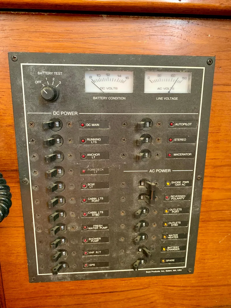 Slide: The Image of Electrical panel on a 1986 Sabre 36 boat, featuring DC and AC power controls. - 40