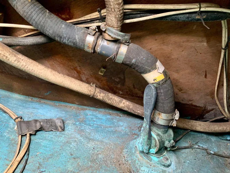 Slide: The Image of Interior view of a 1986 Sabre 36 boat with hoses and valves. - 49