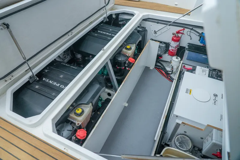 Slide: The Image of Engine compartment of 2017 Jeanneau NC11 boat with visible components and fire extinguisher. - 10