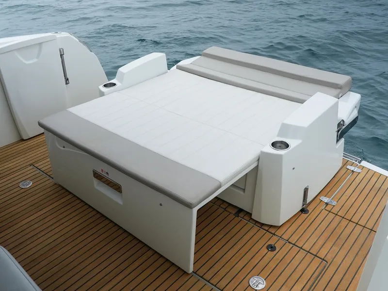 Slide: The Image of Jeanneau NC11 2017 boat with spacious deck and comfortable seating area. - 5