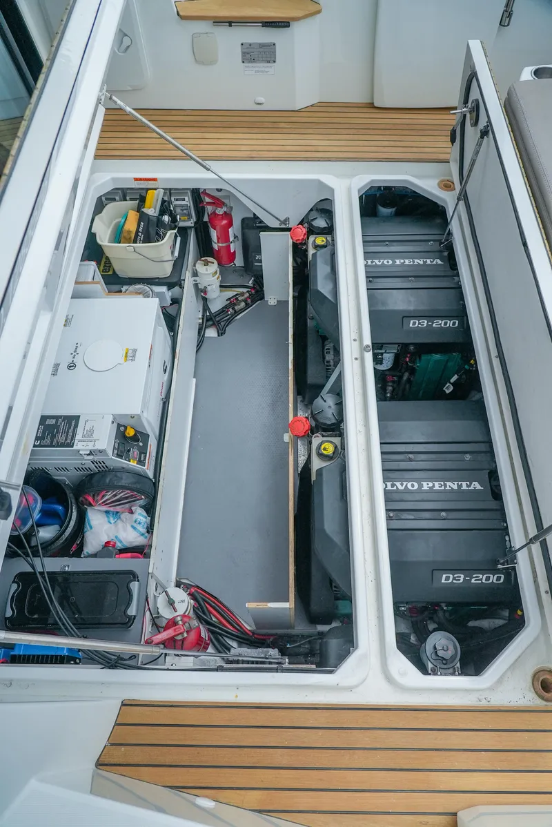 Slide: The Image of Engine compartment of 2017 Jeanneau NC11 boat with Volvo Penta engines and equipment. - 8