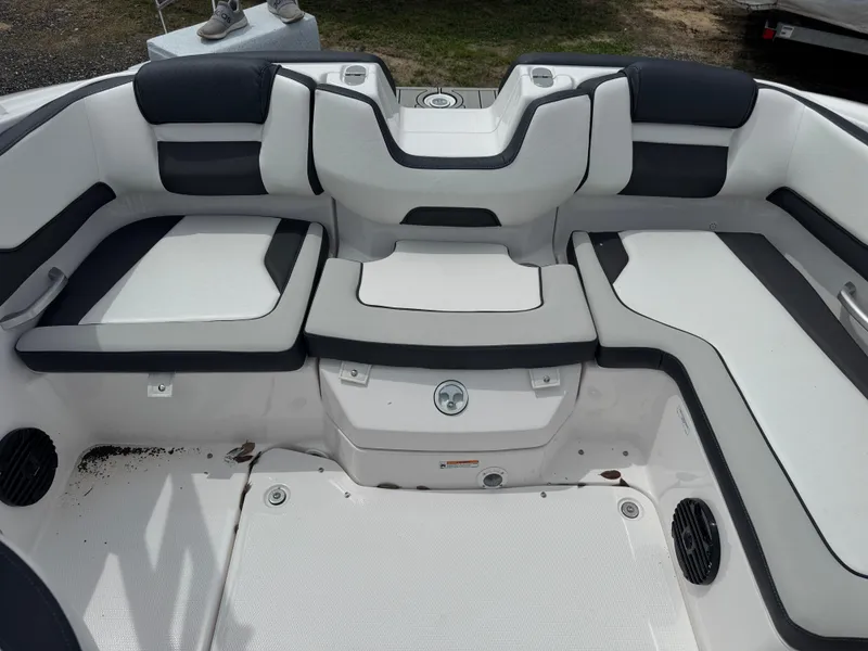 Slide: The Image of 2025 Yamaha Boats 195S interior seating with black and white upholstery. - 13