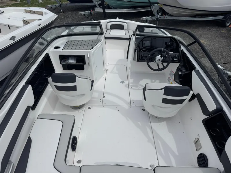 Slide: The Image of 2025 Yamaha Boats 195S interior with sleek seating and modern dashboard design. - 4