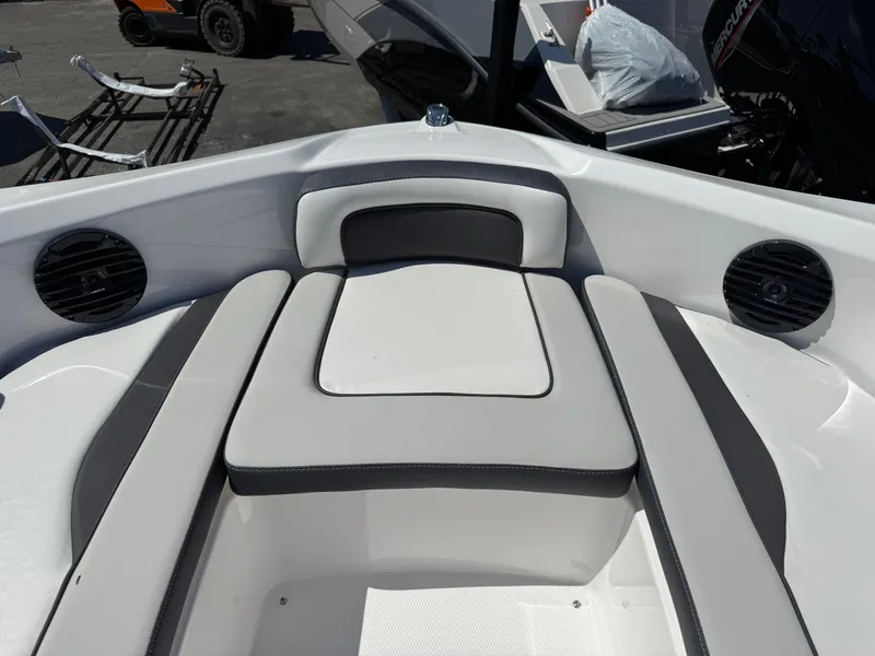 Slide: The Image of 2025 Yamaha Boats 195S interior seating with speakers, showcasing modern design and comfort. - 10
