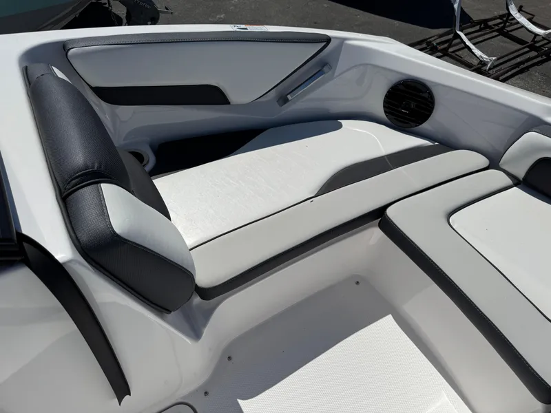 Slide: The Image of Interior seating of 2025 Yamaha Boats 195S, featuring sleek black and white upholstery. - 11
