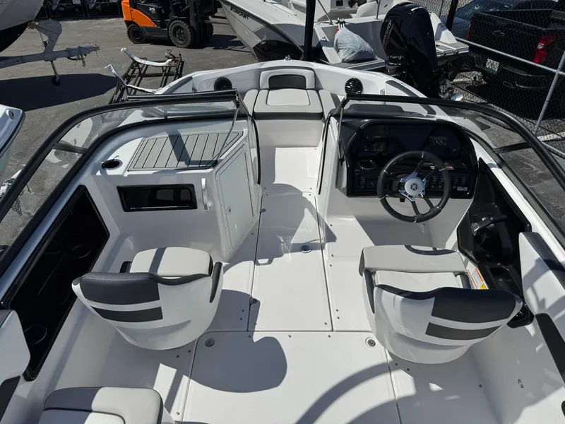 Slide: The Image of 2025 Yamaha Boats 195S interior with dual seats and steering wheel, showcasing modern design. - 6