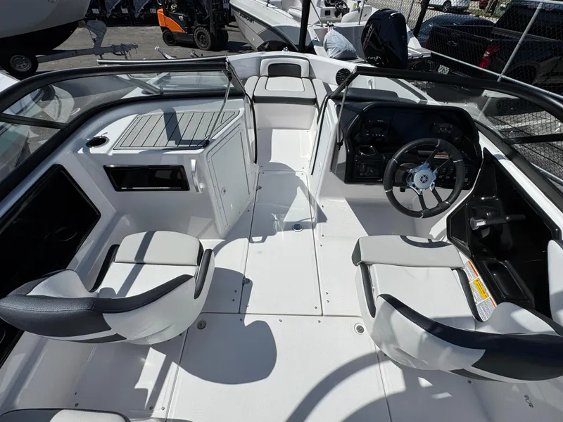 Slide: The Image of 2025 Yamaha Boats 195S interior with sleek seating and modern dashboard design. - 7
