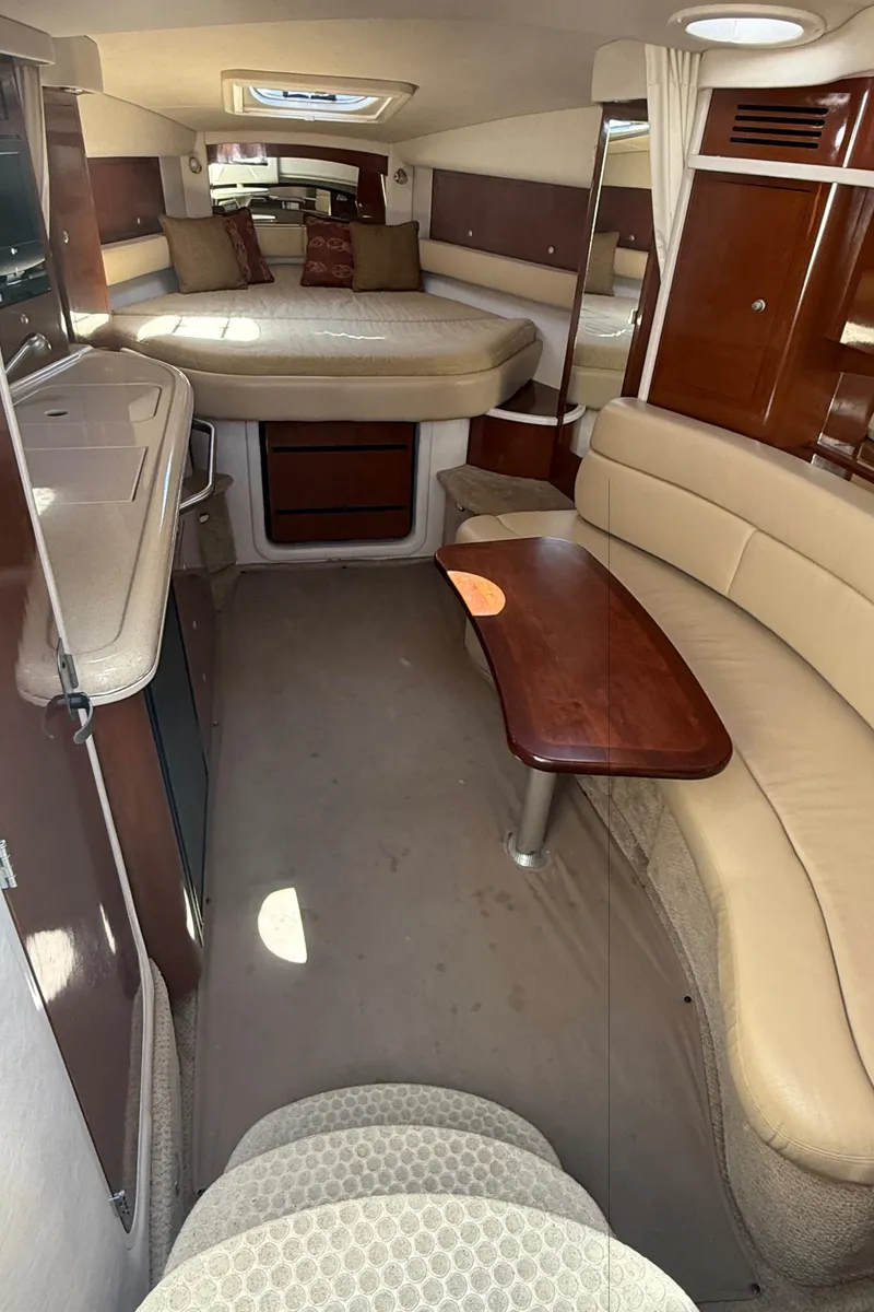 Slide: The Image of Interior of 2008 Sea Ray 340 Sundancer yacht with seating and table. - 16
