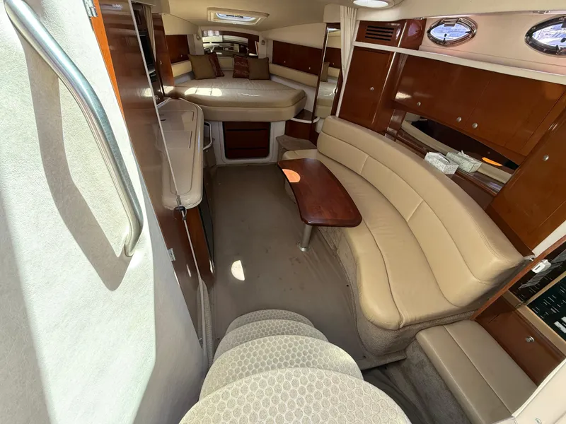Slide: The Image of Interior of 2008 Sea Ray 340 Sundancer yacht with elegant seating and wood finishes. - 18