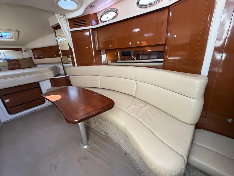 Slide: The Image of Luxurious interior of 2008 Sea Ray 340 Sundancer with leather seating and wooden cabinetry. - 19