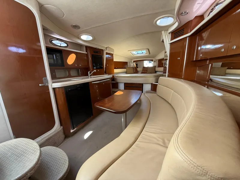 Slide: The Image of Interior of 2008 Sea Ray 340 Sundancer yacht with elegant seating and kitchenette. - 23