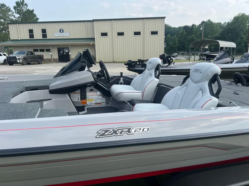 Slide: The Image of 2025 Skeeter ZXR 20 boat with sleek design and modern seating, parked outdoors. - 2
