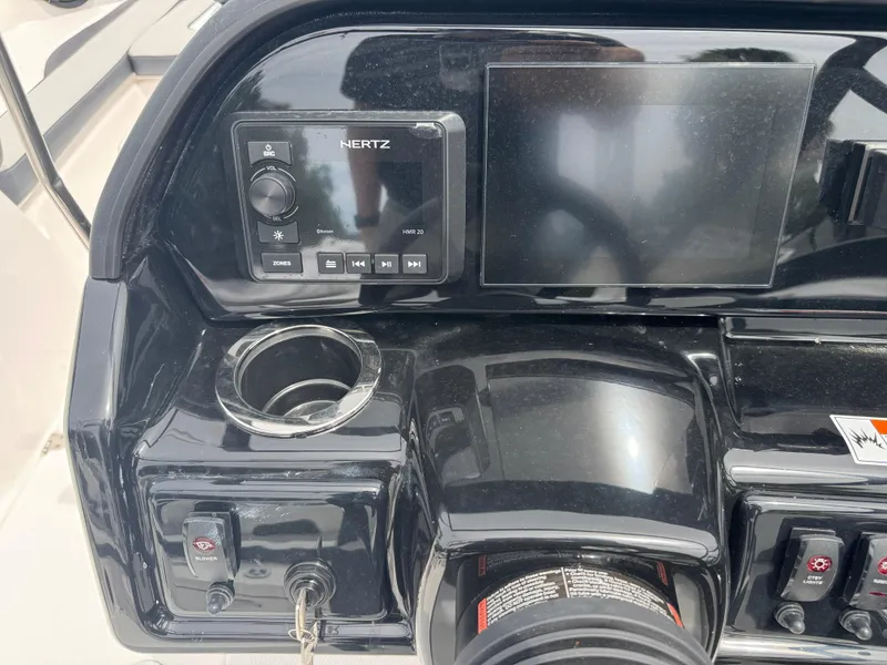 Slide: The Image of Dashboard of 2025 Yamaha Boats 195S featuring controls and display screen. - 17