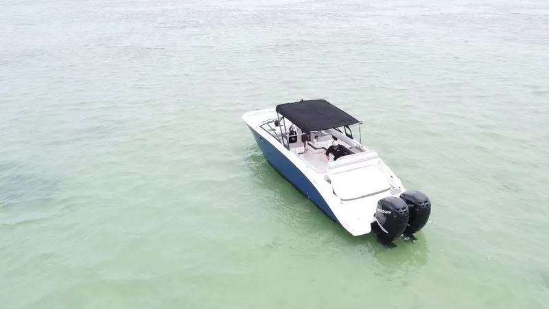 Slide: The Image of 2017 Sea Ray SDX 290 Outboard boat on calm, clear water. - 13