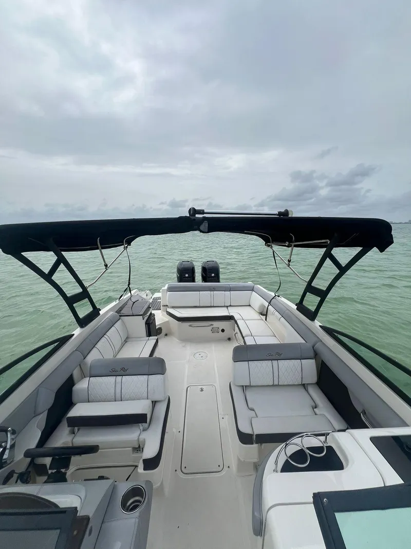 Slide: The Image of 2017 Sea Ray SDX 290 Outboard boat with spacious seating on calm water. - 15