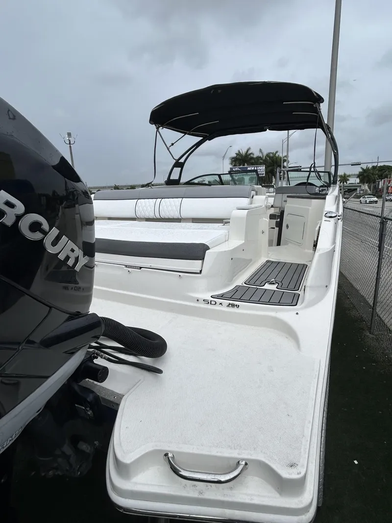 Slide: The Image of 2017 Sea Ray SDX 290 Outboard boat with Mercury engine, docked under cloudy skies. - 23