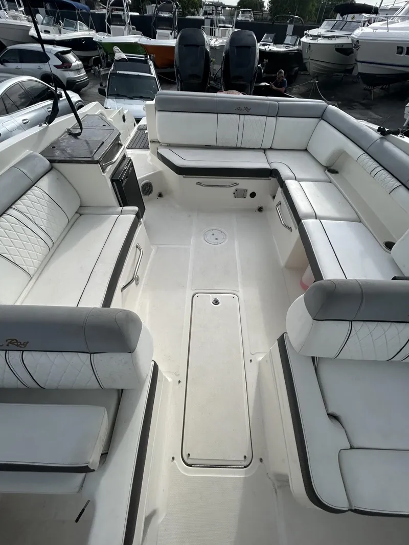 Slide: The Image of 2017 Sea Ray SDX 290 Outboard boat interior with spacious seating and sleek design. - 8