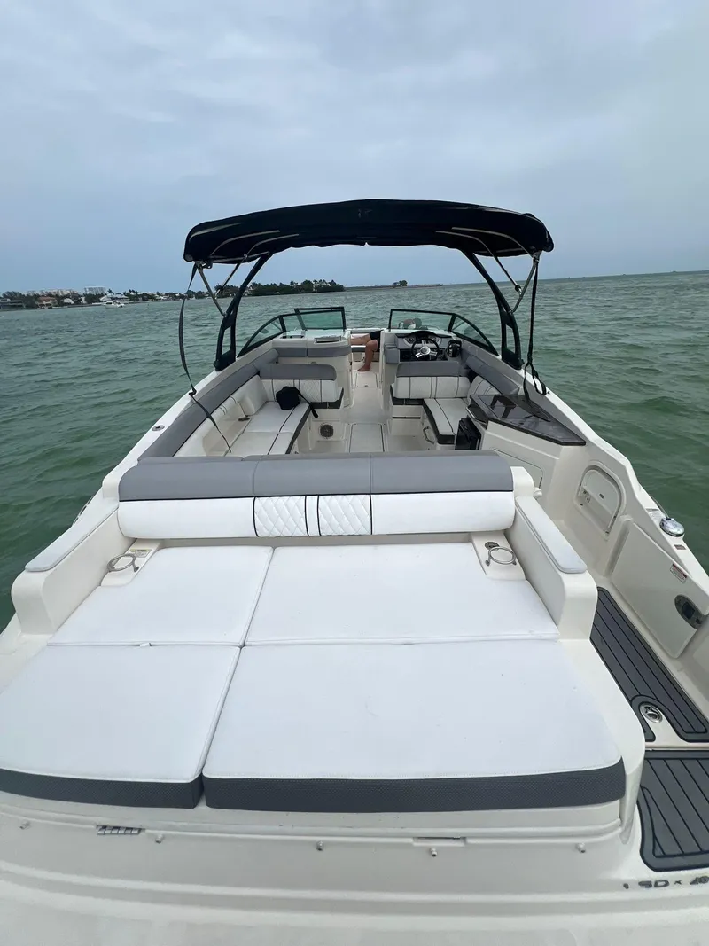 Slide: The Image of 2017 Sea Ray SDX 290 Outboard boat with spacious seating on open water. - 9