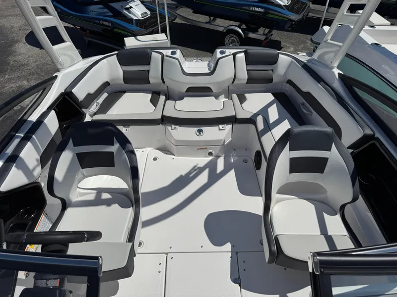 Slide: The Image of 2025 Yamaha Boats 195S interior with sleek seating and modern design. - 13