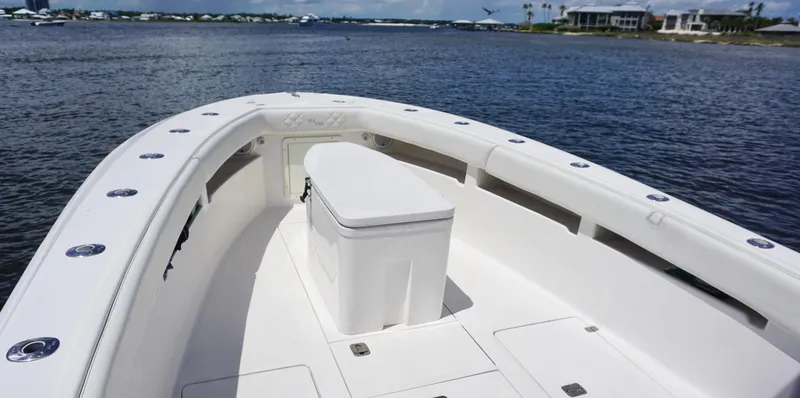 Slide: The Image of 2009 SeaVee 32OB boat deck with seating, on calm water, under clear skies. - 10
