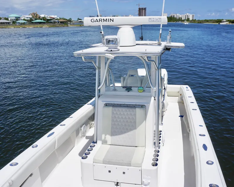 Slide: The Image of 2009 SeaVee 32OB boat with Garmin radar, docked on calm water. - 12