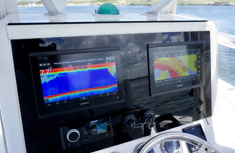 Slide: The Image of Console of 2009 SeaVee 32OB boat with navigation and sonar displays. - 15